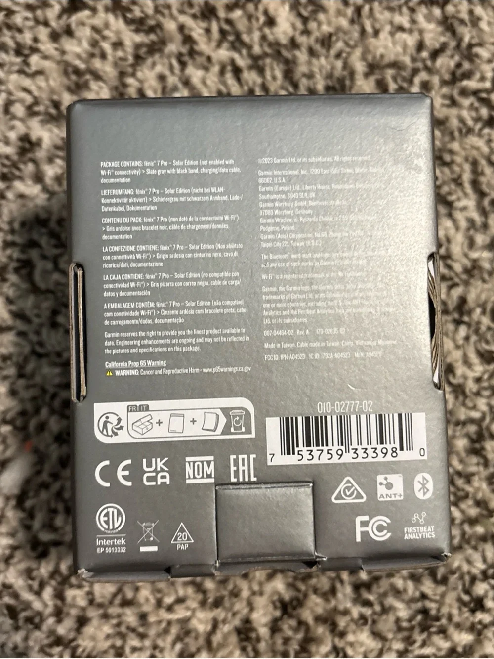 garmin fēnix 7 Pro Solar Edition — slate gray and black with orange accent
